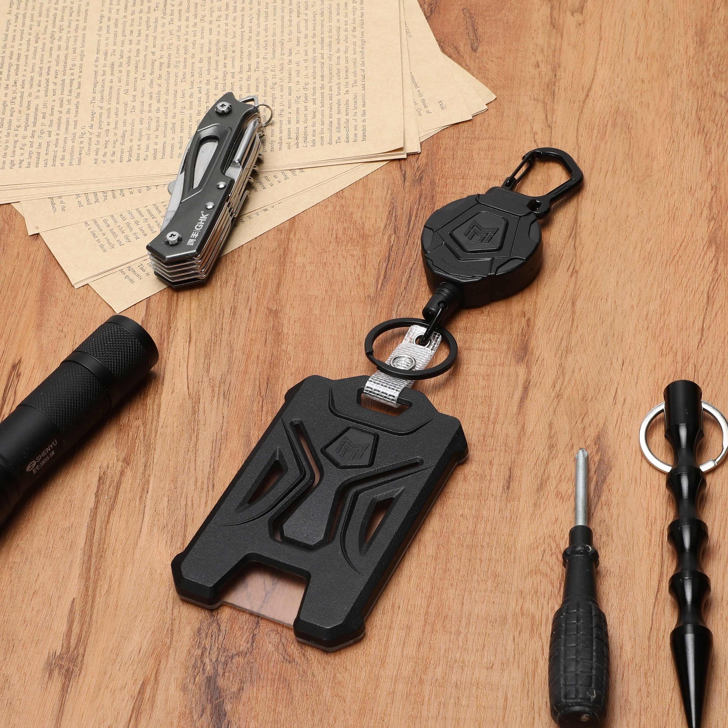 Retractable-Holder-Carabiner-Keychain-Tactical, usage scenario, Desktop, utility knife, torch, screwdriver, sharp objects, paper